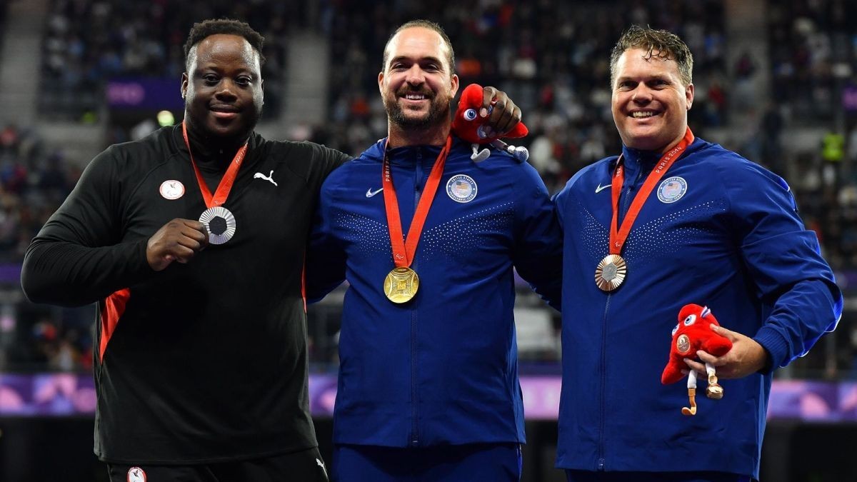 Campbell celebrating in the podium after getting gold. GETTY IMAGES